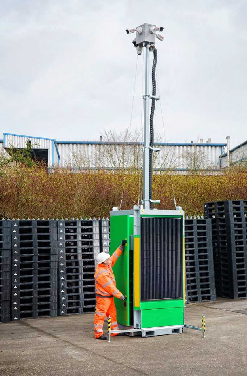 An operator installing a Trime Security Tower with deployable solar panel and automatic mast