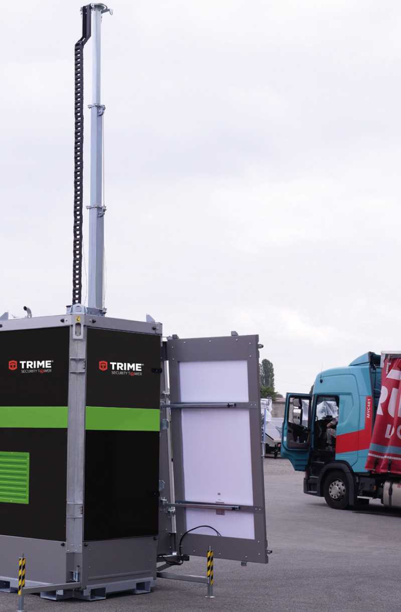 A Trime X-Solar Protection Security Tower a full solar hybrid security tower with deployable solar panels monitoring a loading dock