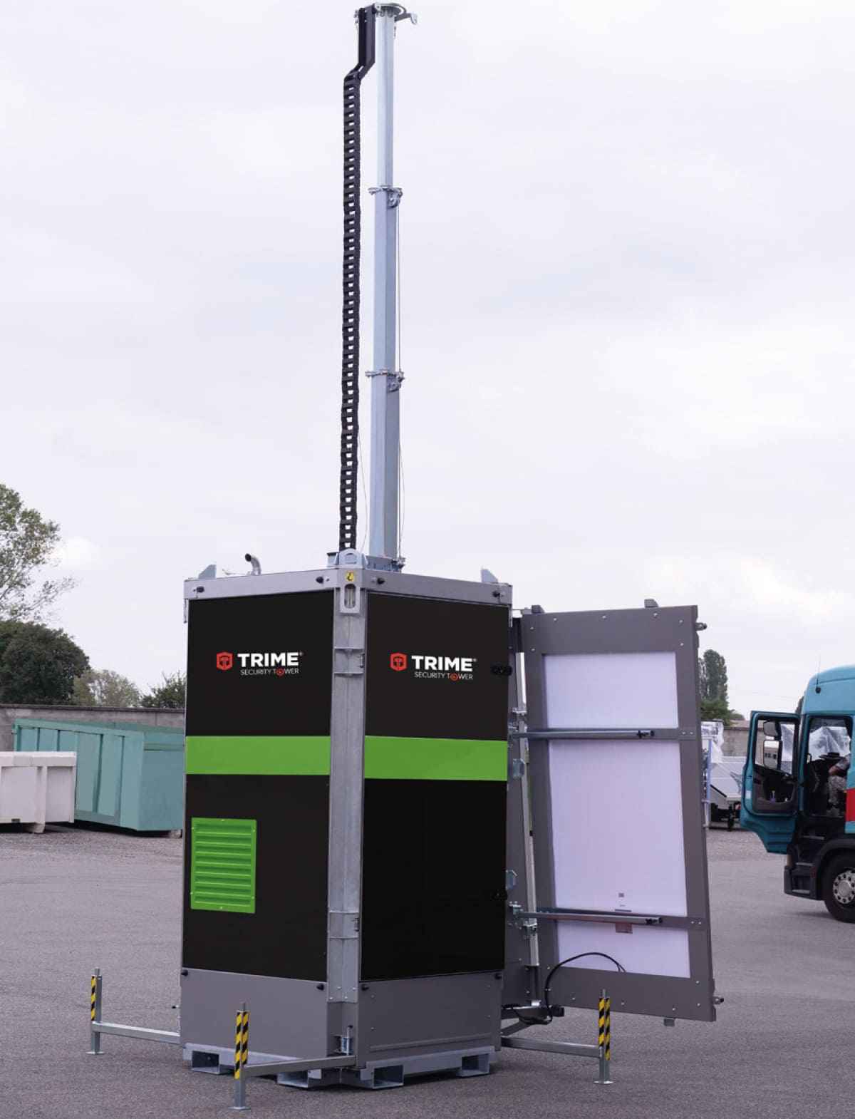a Trime X-SOLAR PROTECTION full solar-hybrid security tower with solar panels monitoring a worksite
