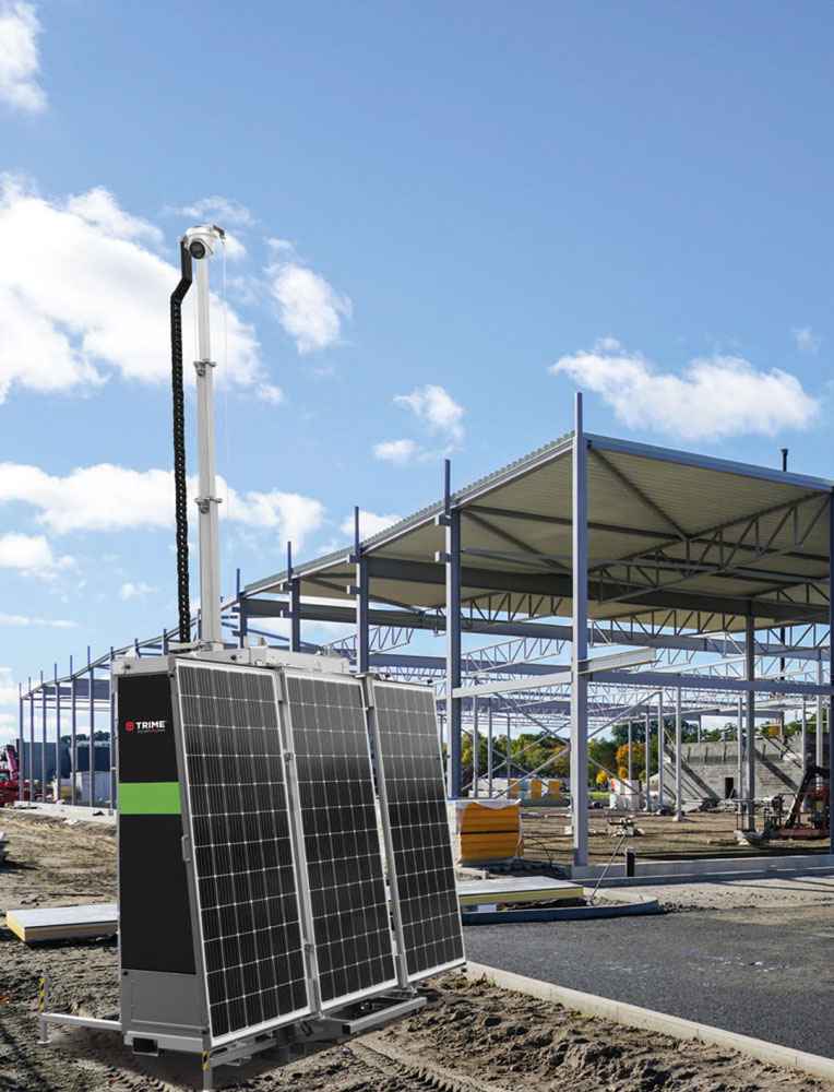 a Trime X-SOLAR SAFETY PRO full solar-hybrid security tower with solar panels monitoring a worksite